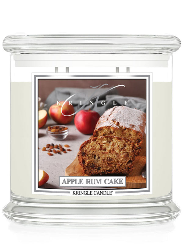 Unlit XL 4-Wick candle with an image of apple rum cake, sliced apples, and spices on the label.