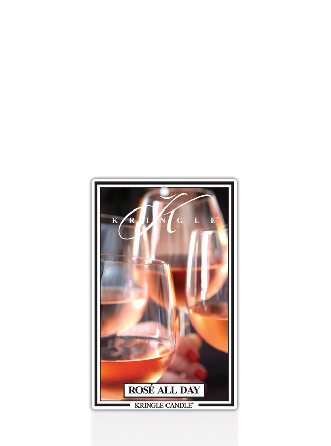Kringle Candle Rosé All Day air freshener with two wine glasses on a white background