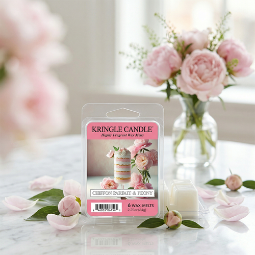 Kringle Candle wax melt package with flowers in the background
