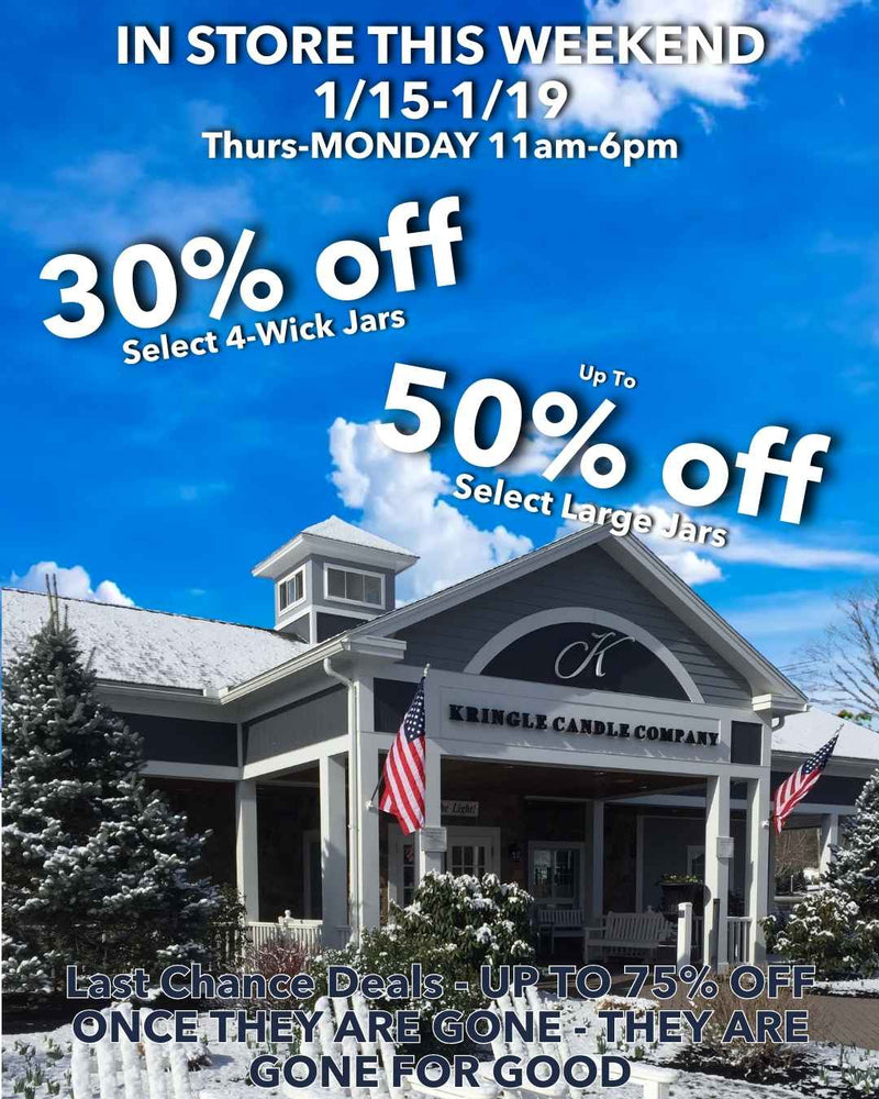 Exterior of the Kringle Candle Company store on a winter day, featuring signage announcing in-store weekend sales with discounts on select 4-wick jars, large jars, and last-chance items.