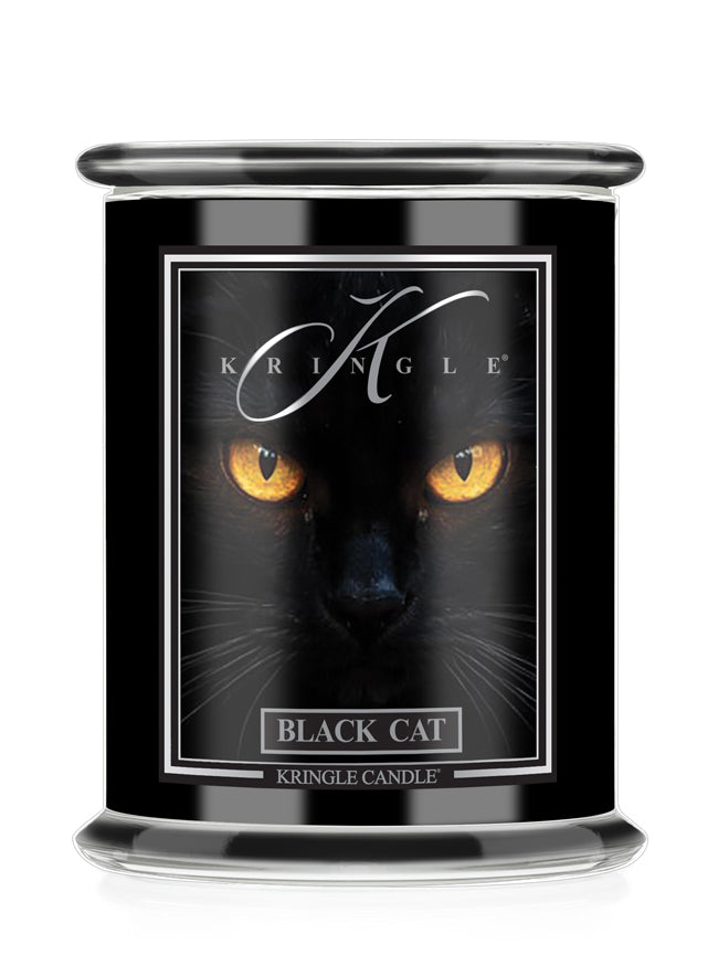 A black glass Halloween jar candle with a matching black lid, featuring a label with a black cat's face and glowing yellow eyes. The label reads 'KRINGLE' and 'BLACK CAT'.