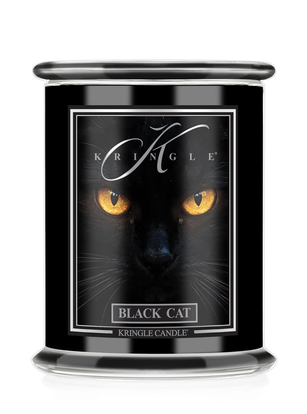 A black glass Halloween jar candle with a matching black lid, featuring a label with a black cat's face and glowing yellow eyes. The label reads 'KRINGLE' and 'BLACK CAT'.