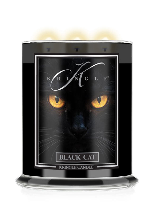 A Kringle Candle in a black Halloween jar featuring a graphic label of a black cat's face with glowing yellow eyes and the text 'BLACK CAT'.