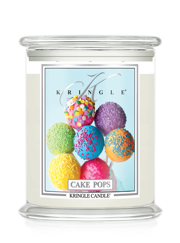 Kringle Candle with colorful cake pop design on a white background