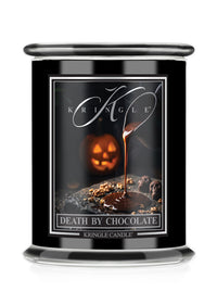 A Kringle Candle jar with a black body and a clear glass top and base, featuring a Halloween-themed label that reads 'Death by Chocolate' with a jack-o'-lantern and chocolate drizzle graphic.