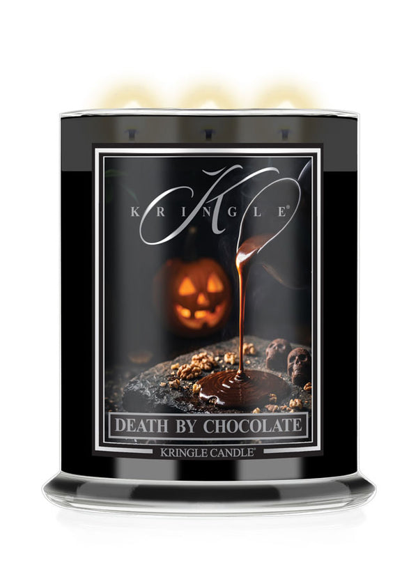 A Kringle Candle in a tall black glass jar with three lit wicks, featuring a Halloween-themed label that reads 'Death by Chocolate' with a chocolate-dripping jack-o'-lantern design.