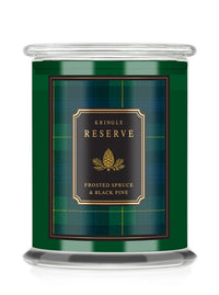 Kringle Candle Reserve green candle jar and plaid label with text "Frosted Spruce & Black Pine."