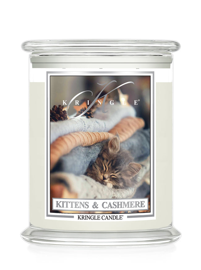 Kittens and Cashmere glass candle jar with lid and label with a kitten sleeping in a pile of soft sweaters.