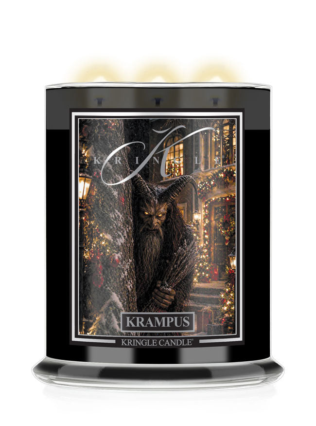 A Kringle Candle Halloween jar labeled 'Krampus', a festive holiday illustration of a horned beast in the center, and three glowing candles visible at the top on a white background.
