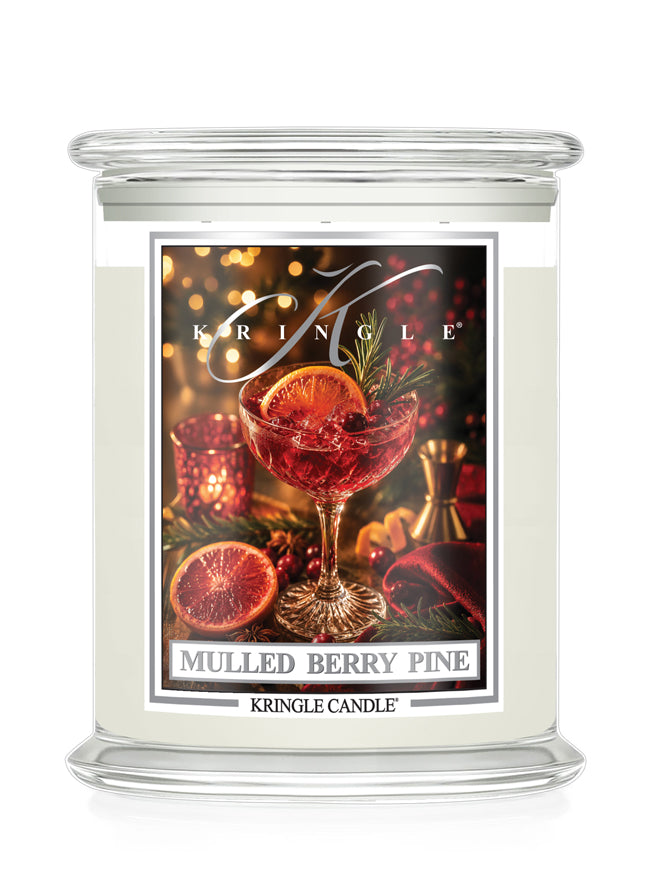 Mulled Berry Pine candle by Kringle Candle with a label featuring a wine glass with a green sprig, berries and orange slice.