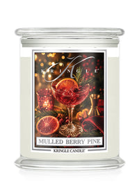 Mulled Berry Pine candle by Kringle Candle with a label featuring a wine glass with a green sprig, berries and orange slice.