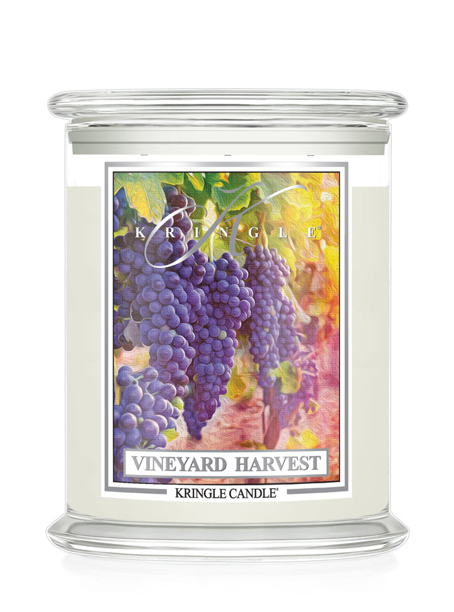A Kringle Candle jar candle labeled 'Vineyard Harvest' with a colorful illustration of purple grape clusters on the front label, shown on a clean white background.