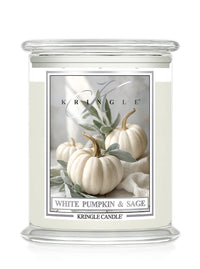 Kringle Candle with a label featuring white pumpkins and sage on a white background