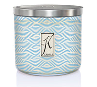 Sea Salt & Tonka 3-wick candle in a jar with blue wavy linel patterns and a silver lid. Central logo reads "Kringle."