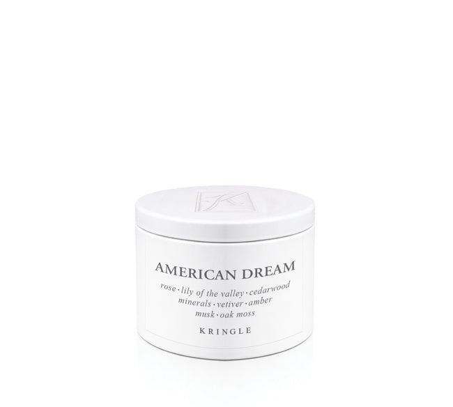 White candle tin container labeled 'American Dream' by Kringle on a white background