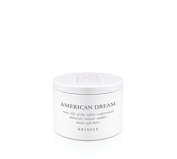 White candle tin container labeled 'American Dream' by Kringle on a white background