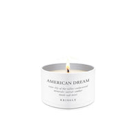 Kringle Candle with 'American Dream' scent in a tin candle container a white background