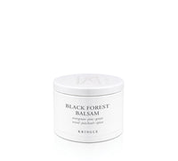 A white cylindrical jar of KRINGLE Black Forest Balsam with black text on the front, set against a seamless white background.