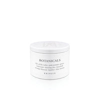 A white metal tin of Kringle Botanicals body wash with black text, set against a seamless white background.