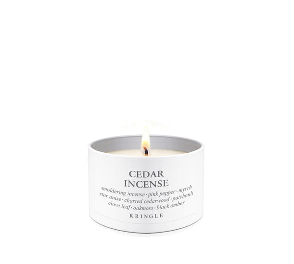 Candle labeled 'Cedar Incense' by Kringle on a white background