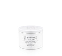 A white round cosmetic jar labeled 'CINNAMON CLOVE ZEST' by Kringle, photographed on a clean white background.