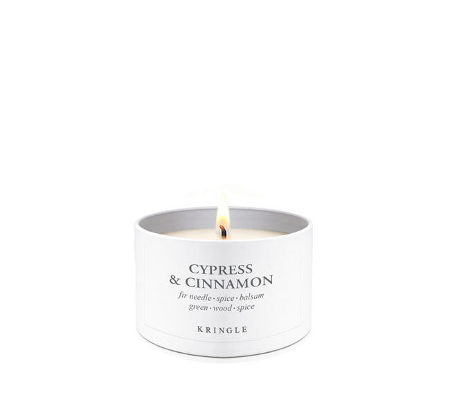 Cypress & Cinnamon Scent in mini candle tin lit single-wick on a white background by Kringle Candle
