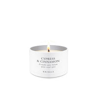 Cypress & Cinnamon Scent in mini candle tin lit single-wick on a white background by Kringle Candle