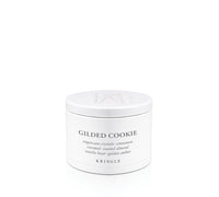 A white cylindrical jar of Kringle Gilded Cookie scented crystals, photographed on a seamless white background.