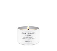 White candle in a tin container labeled 'Amber Wood' by Kringle on a white background
