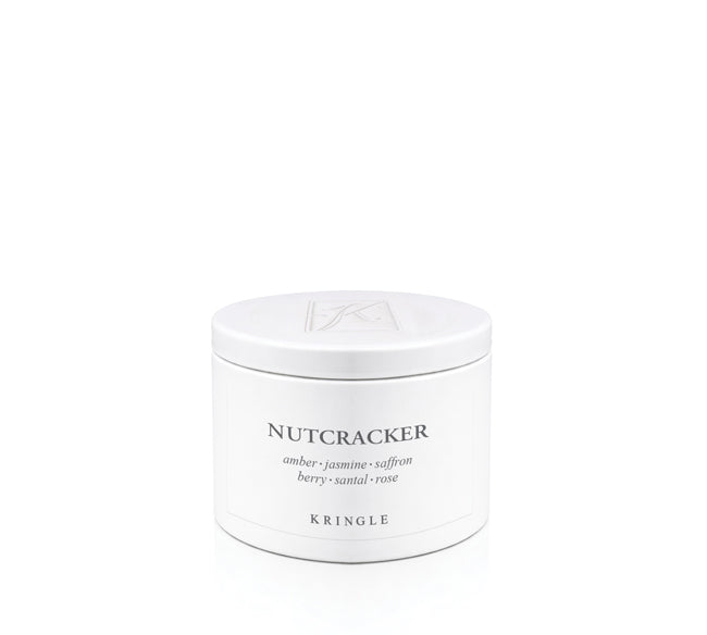 A white cylindrical jar of Kringle Nutcracker scented wax melt, featuring black text and a matching white lid, set against a seamless white background.