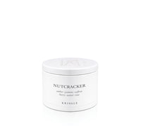 A white cylindrical jar of Kringle Nutcracker scented wax melt, featuring black text and a matching white lid, set against a seamless white background.