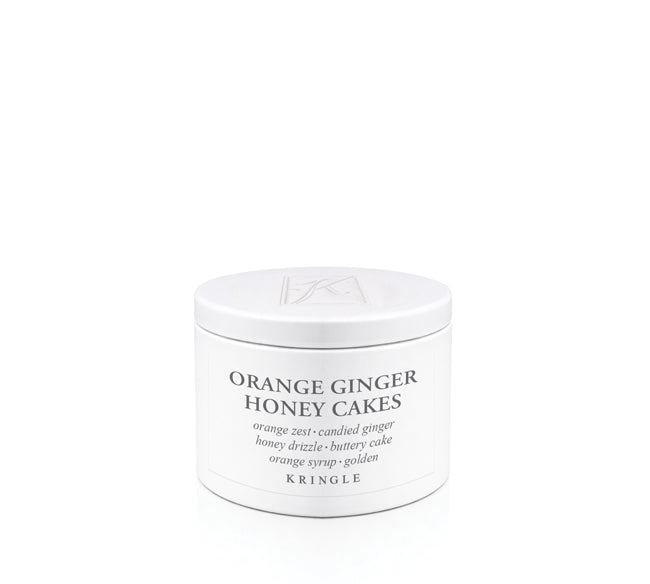 Kringle Candle jar labeled 'Orange Ginger Honey Cakes' on a white background