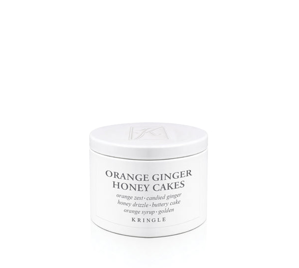 Kringle Candle jar labeled 'Orange Ginger Honey Cakes' on a white background