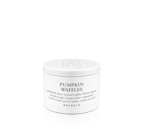 A white cylindrical candle tin of Kringle Pumpkin Waffles on a seamless white background.