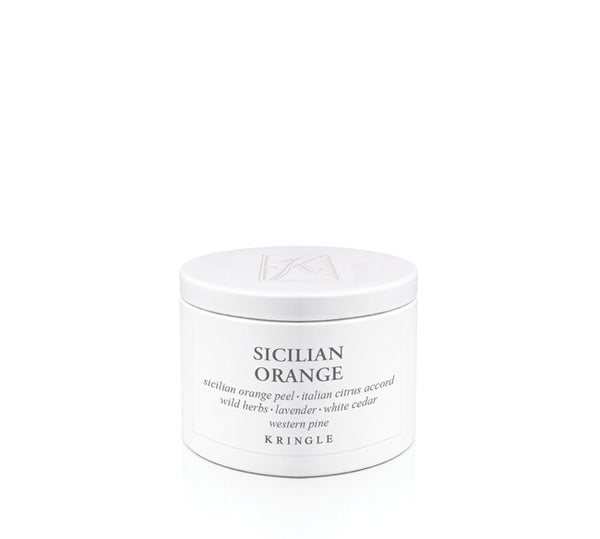 A white cosmetic candle tin labeled 'SICILIAN ORANGE' by Kringle, photographed on a seamless white background.