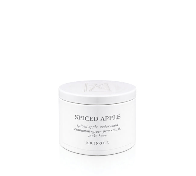 White candle tin labeled 'Spiced Apple' by Kringle on a white background