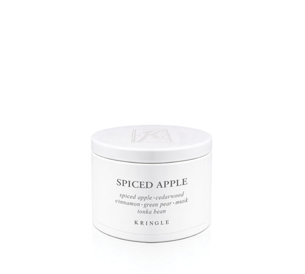 White candle tin labeled 'Spiced Apple' by Kringle on a white background