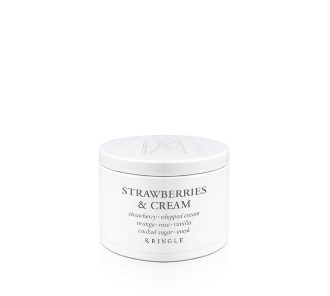 Kringle Candle 'Strawberries & Cream' scent in a tin container on a white background
