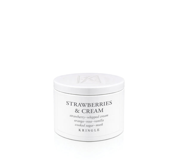Kringle Candle 'Strawberries & Cream' scent in a tin container on a white background