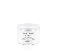 Kringle Candle tin labeled 'Sun Dried Linen' on a white background