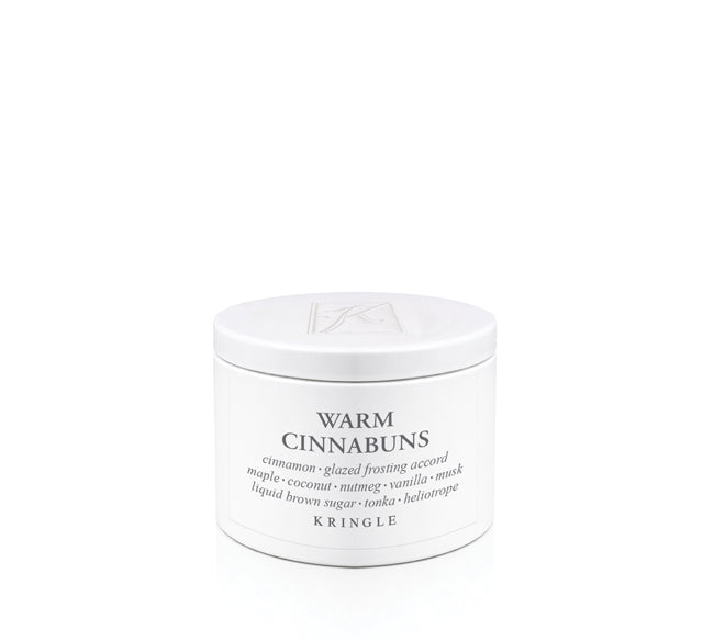 Kringle Creamery 'Warm Cinnabuns' candle tin on a white background
