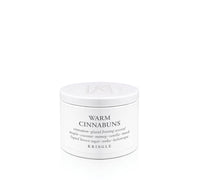 Kringle Creamery 'Warm Cinnabuns' candle tin on a white background