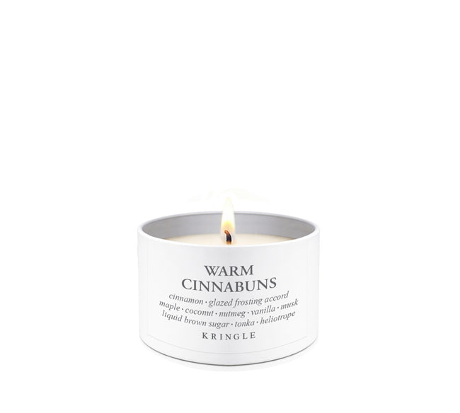 Kringle Candle tin with 'Warm Cinnabuns' description on a white background