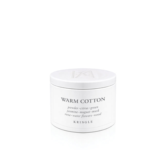 Kringle Candle tin labeled 'Warm Cotton' on a white background