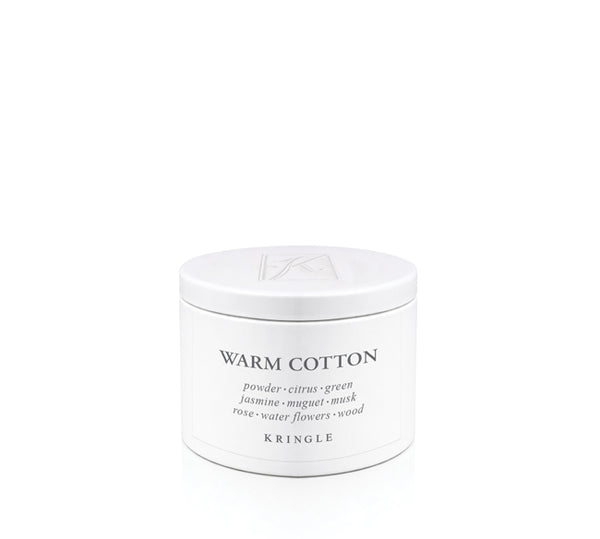 Kringle Candle tin labeled 'Warm Cotton' on a white background