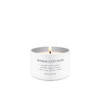 Candle tin labeled 'Warm Cotton' by Kringle Candle on a white background.