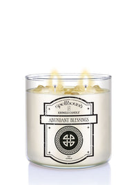 Two-wick candle labeled 'Abundant Blessings' by Spellbound on a white background