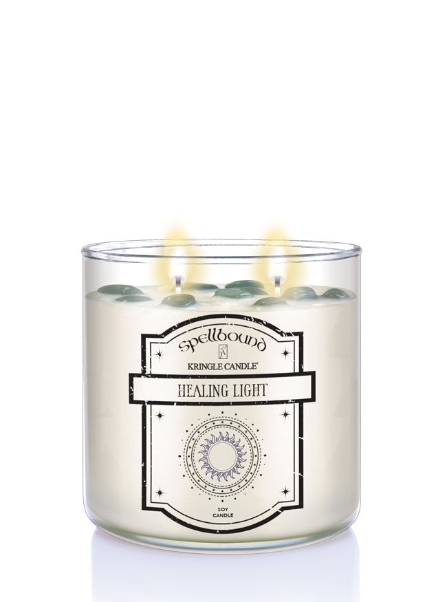Healing Light Lit Candle with a label on a white background