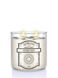 Healing Light Lit Candle with a label on a white background