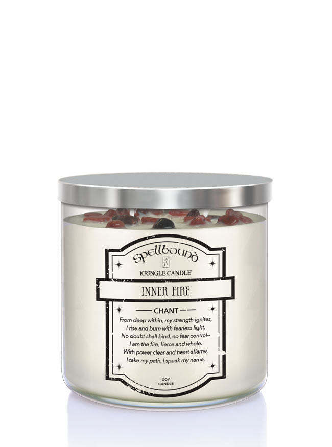 Spellbound Inner Fire candle with silver lid on a white background showing back of candle